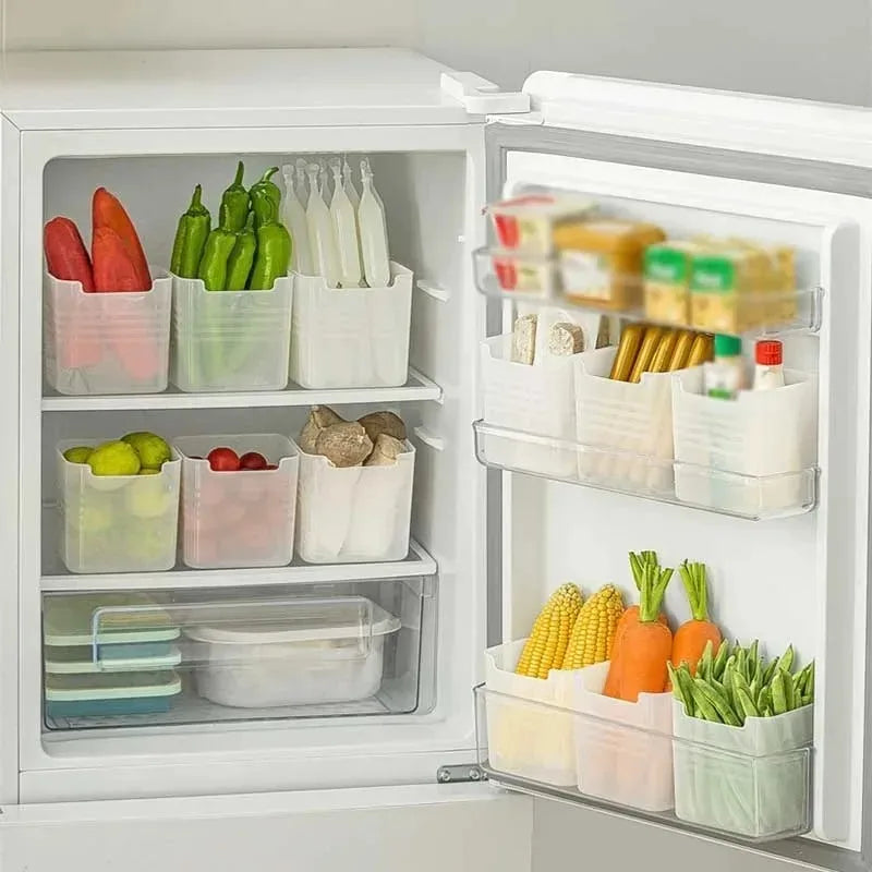 Open refrigerator with organized food items in clear containers